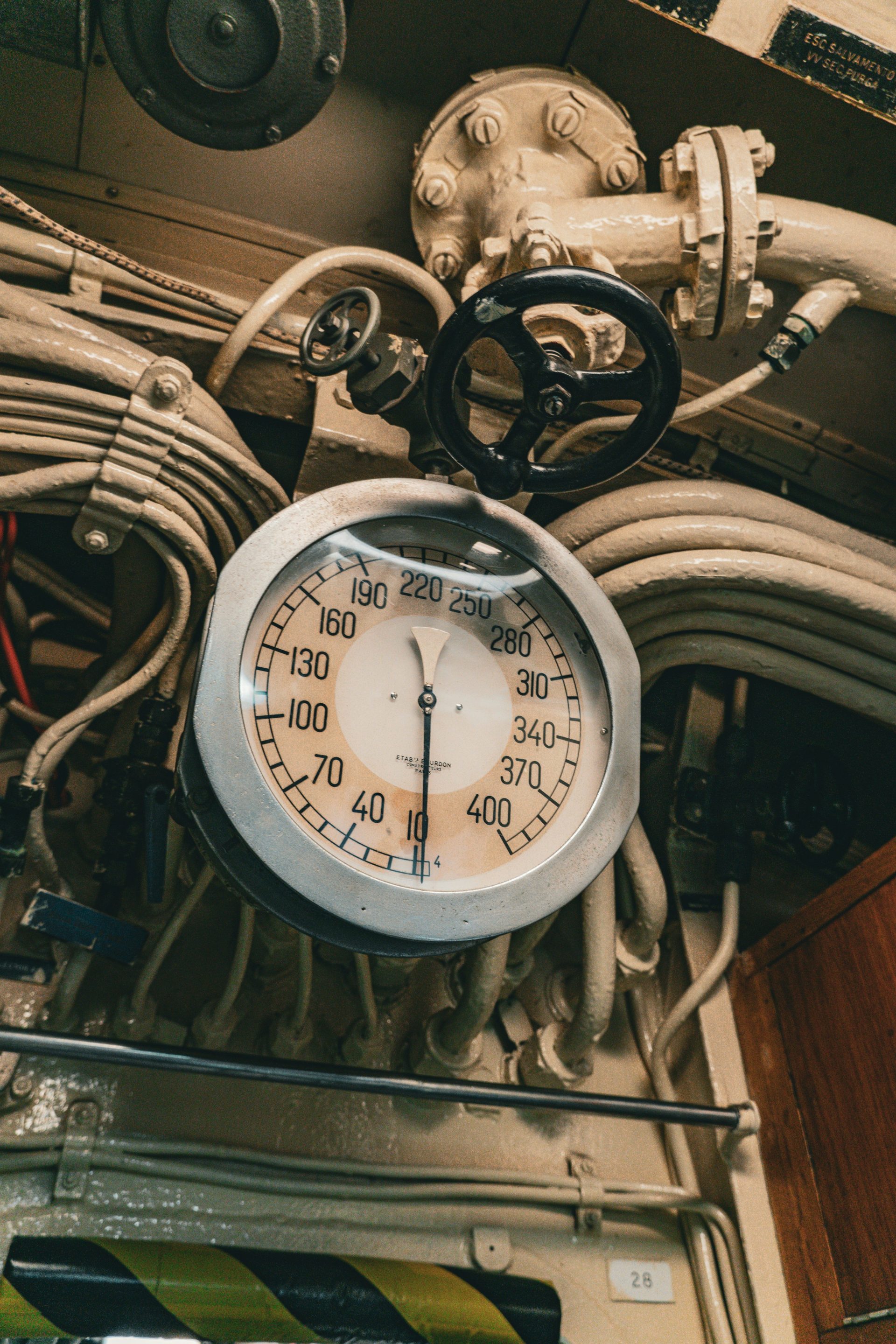 A vintage gauge and control panel are shown.